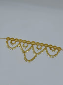 Full angled view of the gold-tone filigree medallion coin disc swag waist belt showing the full row of linked medallions and cascading scalloped coin disc swag drops
