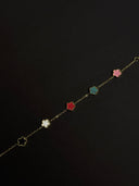 Necklace with colorful flower-shaped pendants on a black background