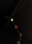 Bracelet with floral charms on a black fabric background