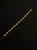 Gold bracelet on a black background