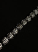 Close-up of a bracelet on a black background