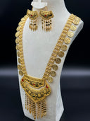 Angled full view of the 2-piece Ottoman coin bib set on a bust — opera necklace with engraved coin charms and layered bib pendant with tassel fringe, earrings displayed above