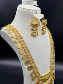 Side angle view of the Ottoman coin bib necklace on a bust showing the multi-strand coin charm chain and matching arch-top tassel drop earrings