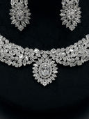 Front view of the collar necklace and chandelier earrings highlighting the large oval halo centerpiece pendant surrounded by marquise stone rays