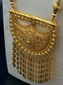 Detail of the long bicone bead necklace chain and crescent drop earring showing open-lattice hollow bicone beads with fan-shaped connector caps
