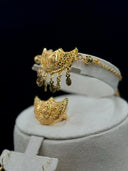 Front view of the crescent drop earrings displayed on a white velvet bust showing matching crescent motif and multi-strand coin drop fringe