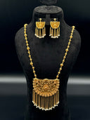 Full view of the 3-piece gold-tone filigree half-moon necklace and earring set displayed on a black bust